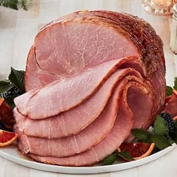 Premium Bone-in Hickory Smoked Spiral-sliced Ham from the Missouri Ozarks 7.25-8.5 lbs from Kansas City Steak Company.